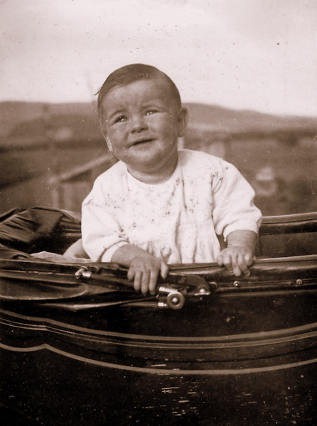 Child in a Silver Cross pram